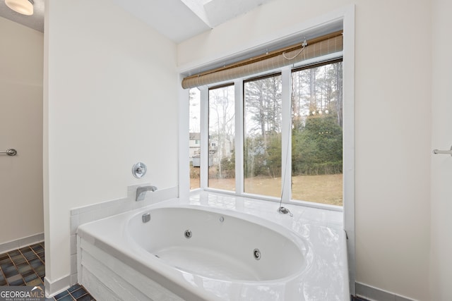 bathroom featuring a relaxing tiled tub