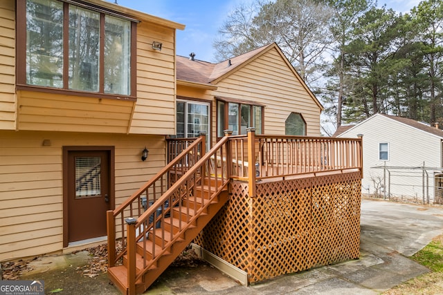 back of property featuring a deck