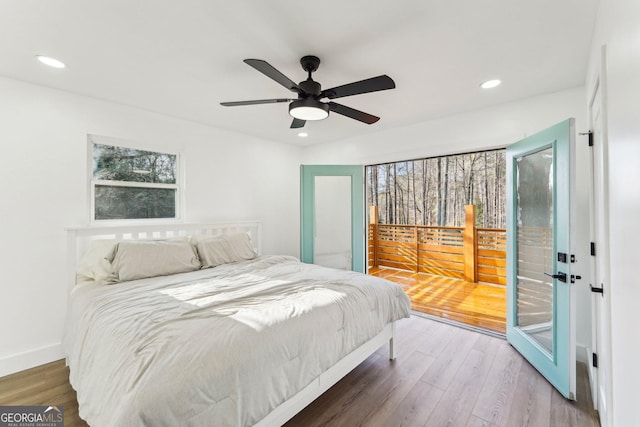 bedroom with ceiling fan, access to outside, and wood-type flooring