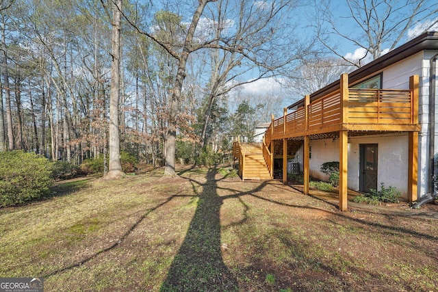 view of yard featuring a wooden deck