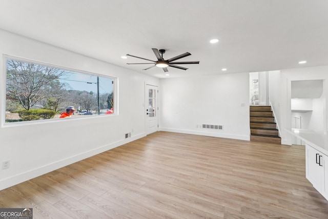 spare room with ceiling fan and light hardwood / wood-style floors