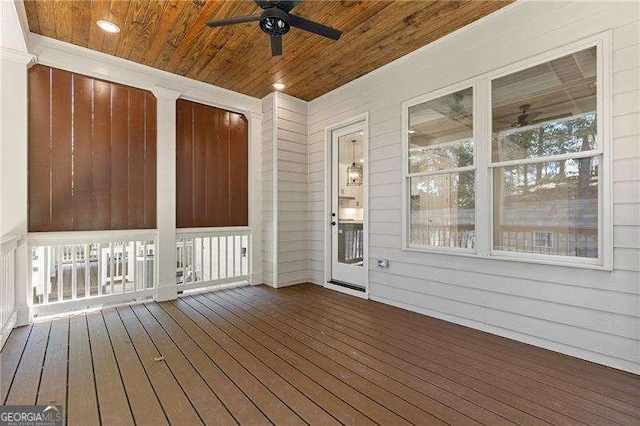 wooden terrace featuring ceiling fan