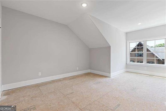 bonus room featuring lofted ceiling