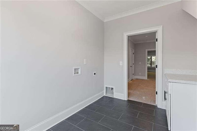 laundry area with washer hookup, dark tile patterned flooring, crown molding, and hookup for an electric dryer