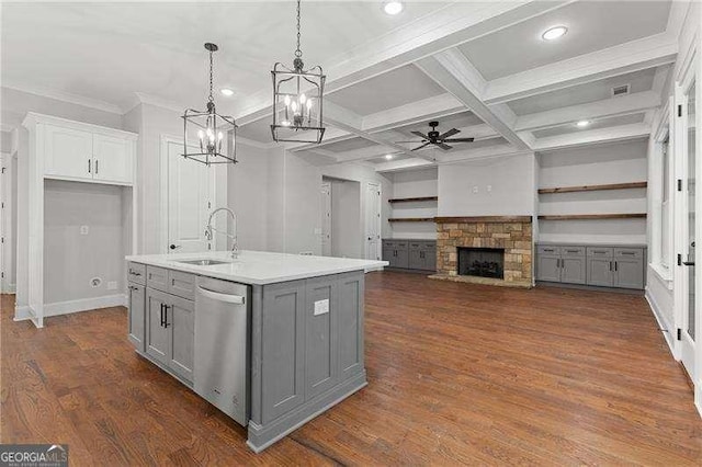 kitchen featuring sink, gray cabinetry, hanging light fixtures, a center island with sink, and dishwasher