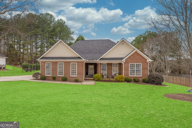 ranch-style home featuring a front yard