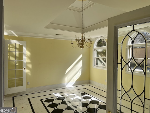 interior space with a raised ceiling, crown molding, and an inviting chandelier