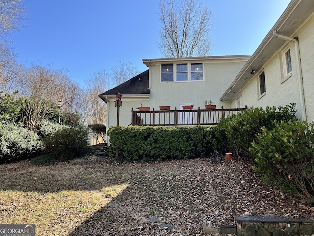 rear view of property with a deck