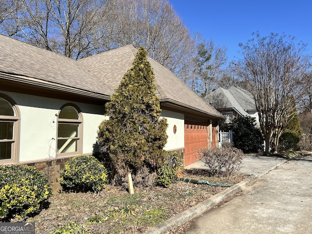 view of side of home with a garage