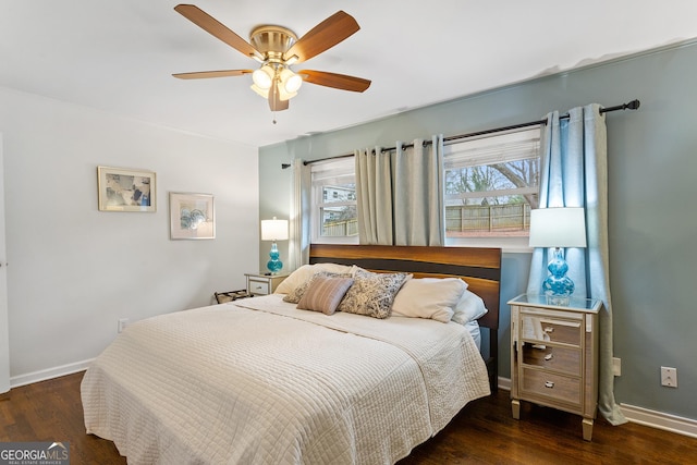 bedroom with dark wood-type flooring and ceiling fan