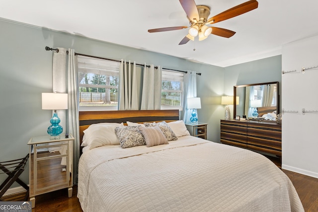 bedroom featuring dark wood-type flooring and ceiling fan