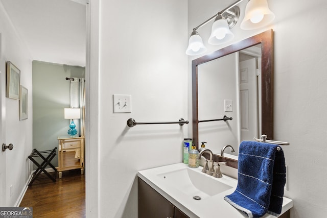 bathroom featuring vanity and hardwood / wood-style floors