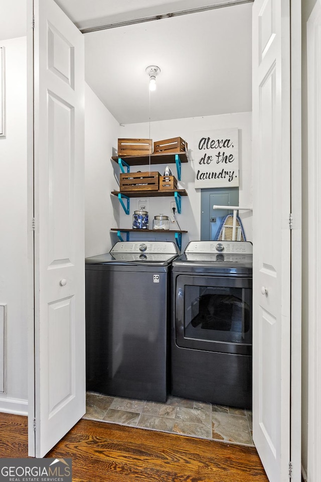 washroom with dark wood-type flooring and separate washer and dryer