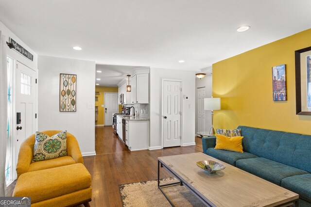 living room with dark hardwood / wood-style floors