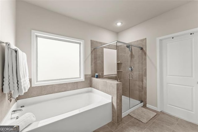 bathroom with tile patterned floors and plus walk in shower