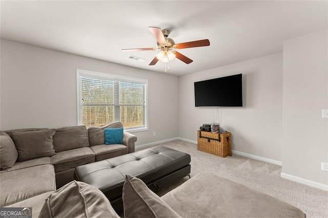 carpeted living room featuring ceiling fan