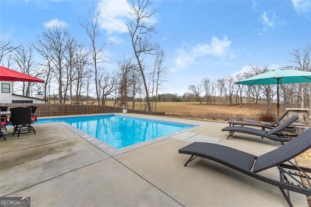 view of swimming pool featuring a patio area