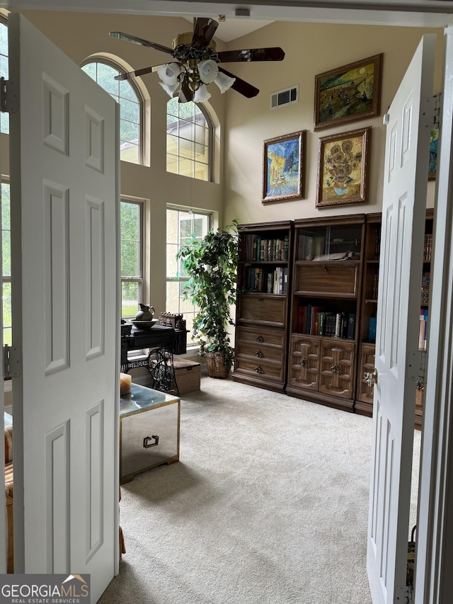 4230 Joe Stephens Rd, Franklin, GA 30217 - foyer entrance featuring carpet flooring, ceiling fan, and a towering ceiling
