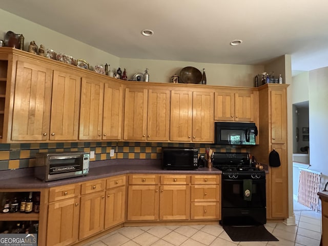 4230 Joe Stephens Rd, Franklin, GA 30217 - kitchen featuring black appliances, light tile patterned flooring, decorative backsplash, and dark countertops