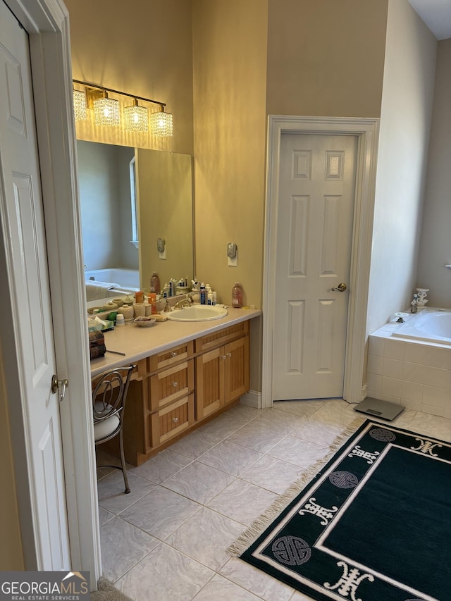 bathroom featuring a garden tub and vanity