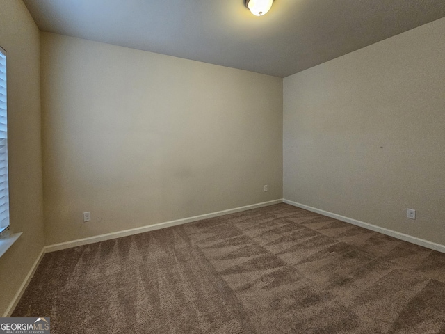 empty room featuring carpet flooring