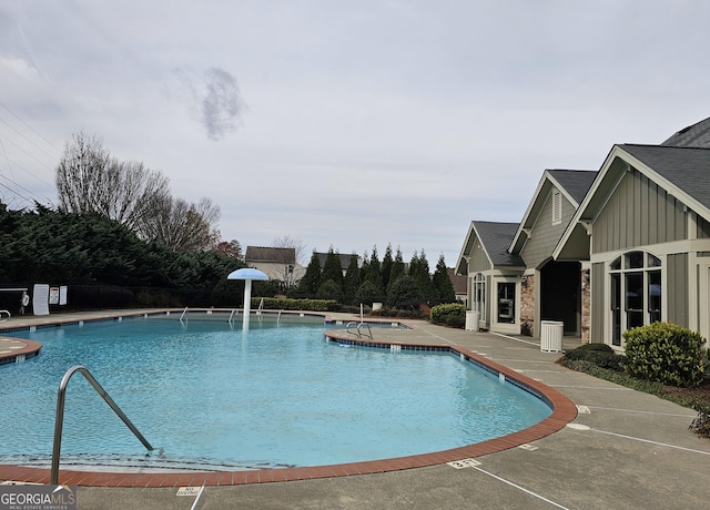 view of swimming pool with a patio area