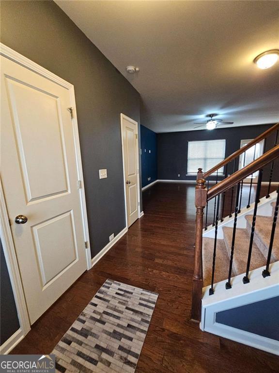 corridor featuring dark hardwood / wood-style floors