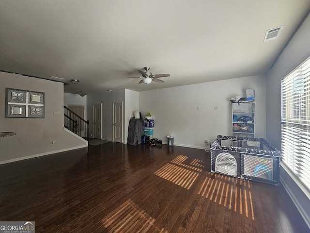 unfurnished room featuring dark hardwood / wood-style floors and ceiling fan