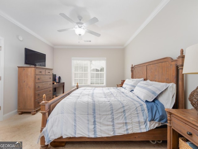 bedroom with ceiling fan, ornamental molding, and light carpet