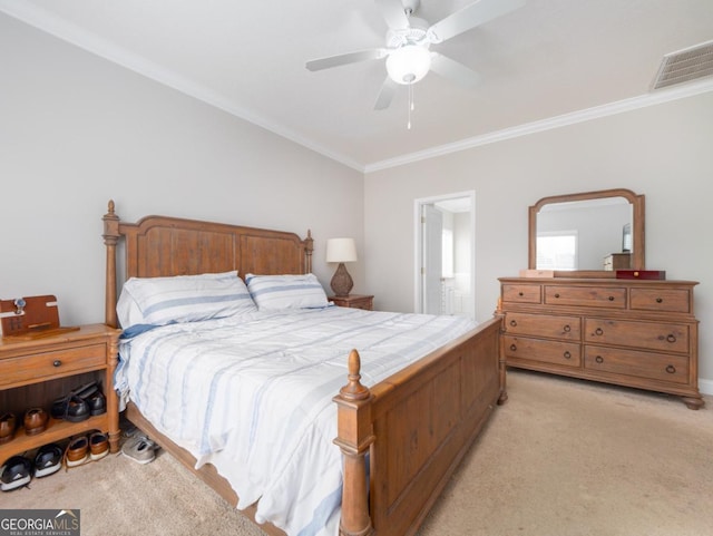 bedroom with ceiling fan, ornamental molding, connected bathroom, and light carpet