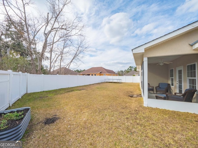 view of yard featuring ceiling fan