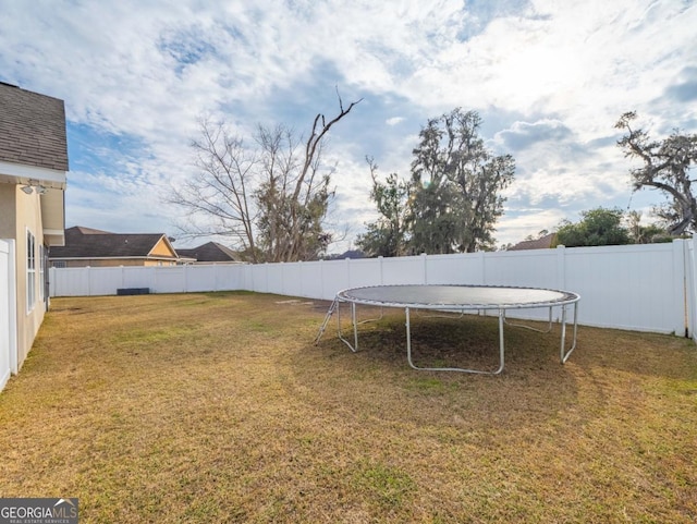 view of yard featuring a trampoline