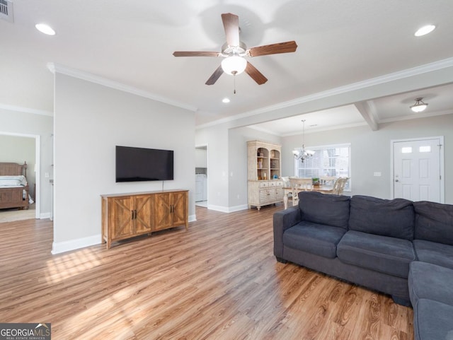 living room featuring ornamental molding, ceiling fan with notable chandelier, and light hardwood / wood-style flooring