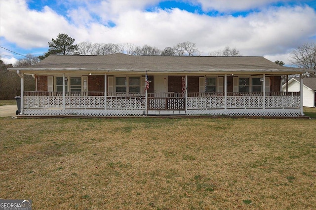 view of front of property with covered porch and a front lawn