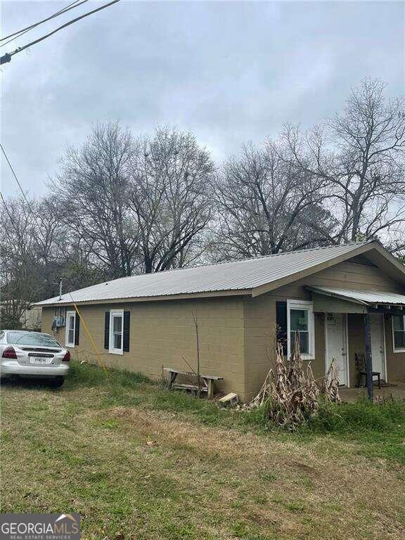 view of home's exterior with a yard