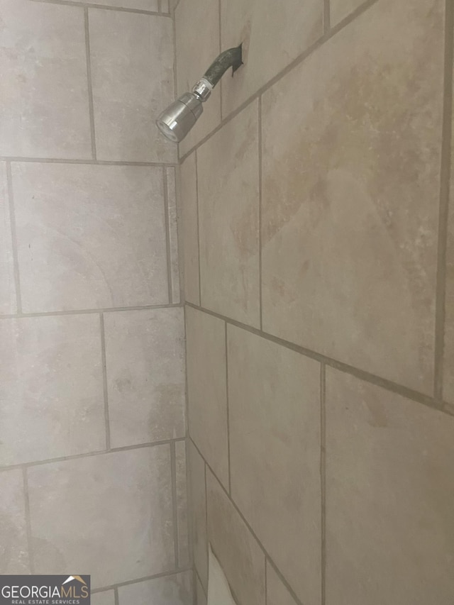 room details with a tile shower