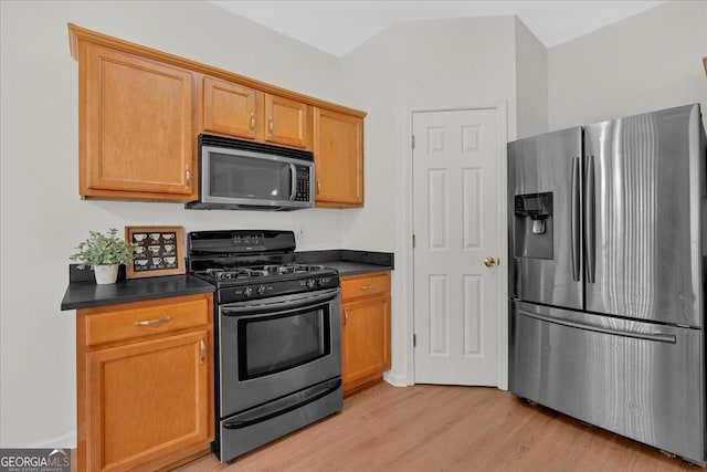 kitchen featuring appliances with stainless steel finishes and light wood-type flooring