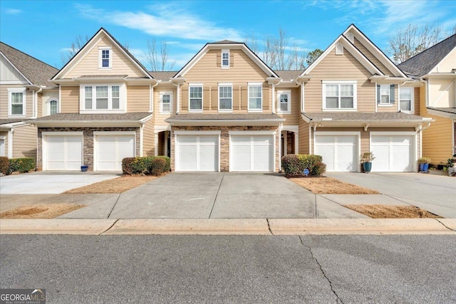 multi unit property featuring a garage