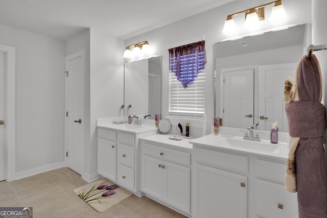 bathroom with tile patterned flooring and vanity