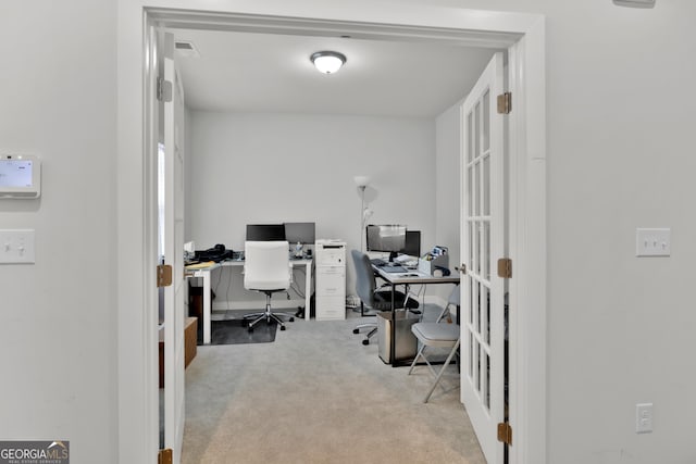 office area with french doors and light colored carpet