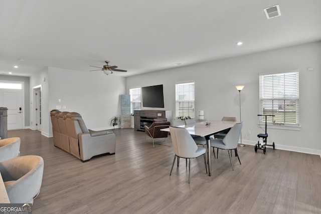 dining area featuring ceiling fan and light hardwood / wood-style floors