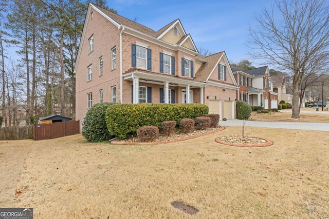 view of front facade with a garage and a front yard