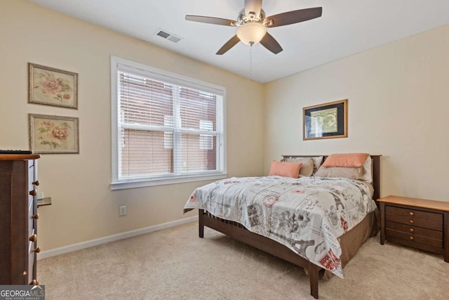 bedroom featuring ceiling fan and light colored carpet