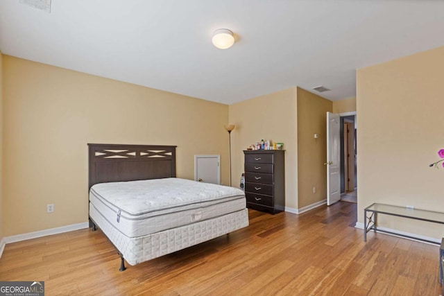 bedroom with wood-type flooring