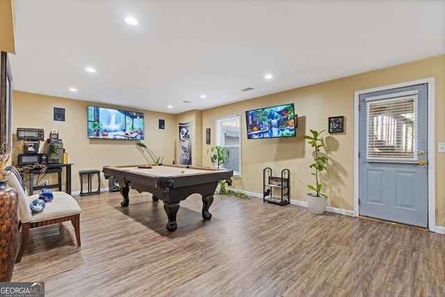 rec room with pool table, a wealth of natural light, and light wood-type flooring