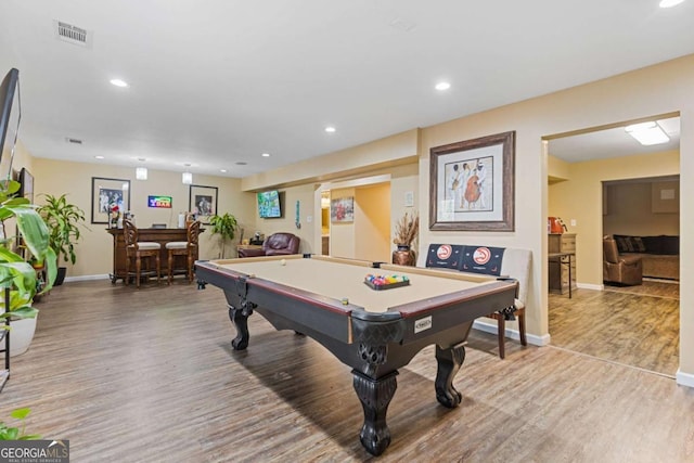 rec room featuring indoor bar, light hardwood / wood-style floors, and billiards