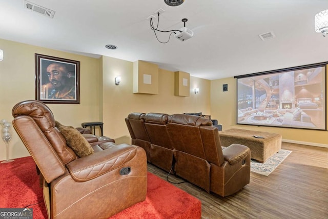 home theater room with wood-type flooring