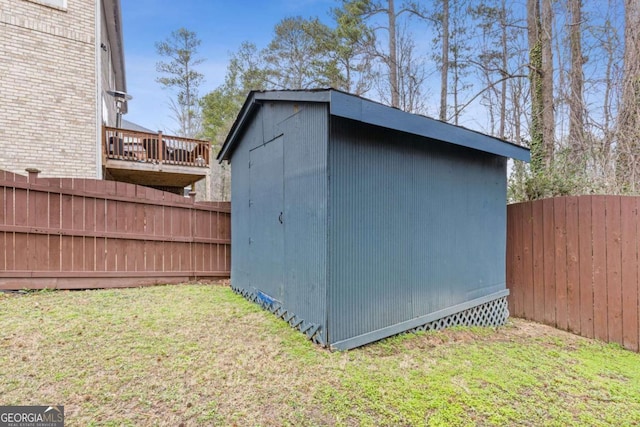 view of outdoor structure featuring a lawn