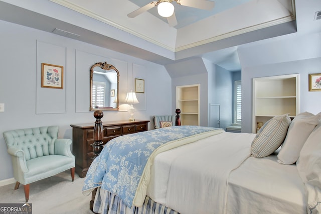 bedroom featuring multiple windows, a walk in closet, carpet flooring, and ceiling fan