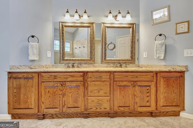 bathroom with tile patterned floors, vanity, and a tile shower